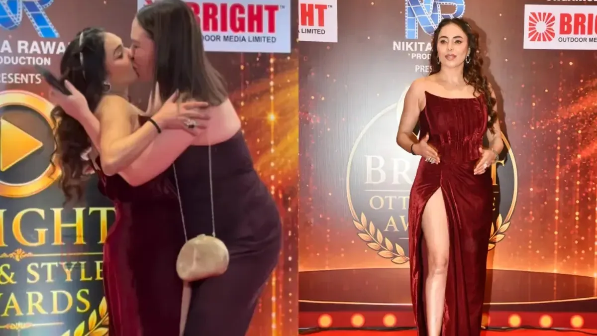 Nikita Rawal looking shocked on a red carpet.