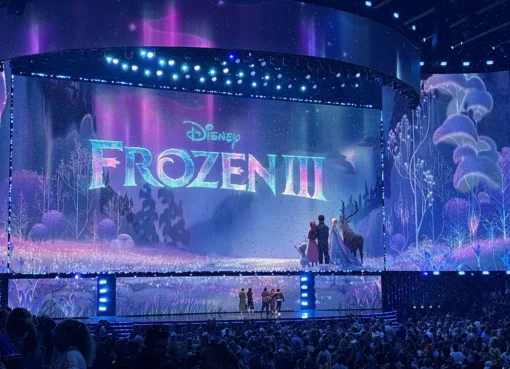 Anna and Kristoff from Frozen smiling warmly in a snowy Arendelle setting, with Elsa and Olaf nearby.