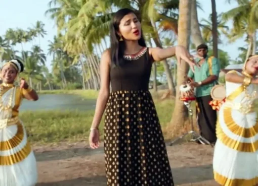 A group of people celebrating Onam with traditional decorations and music.