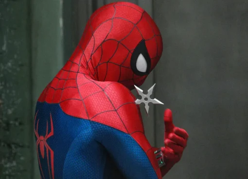 Spider-Man swinging through a city skyline, wearing his iconic red and blue suit.