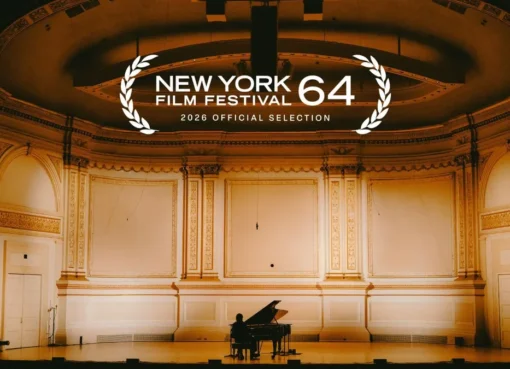A concert stage with a musician performing under spotlights, filmed in a cinematic style.