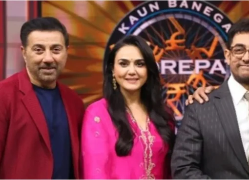 Preity Zinta and Aamir Khan smiling and interacting at an event.