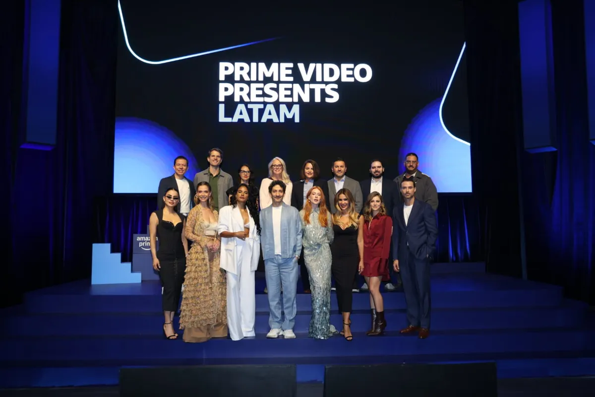 People watching content on a screen with Latin American-inspired visuals.