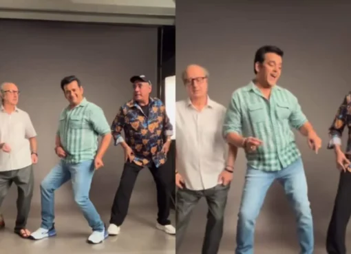 Ravi Kishan, Anupam Kher, and Boman Irani smiling and posing together on a film set.