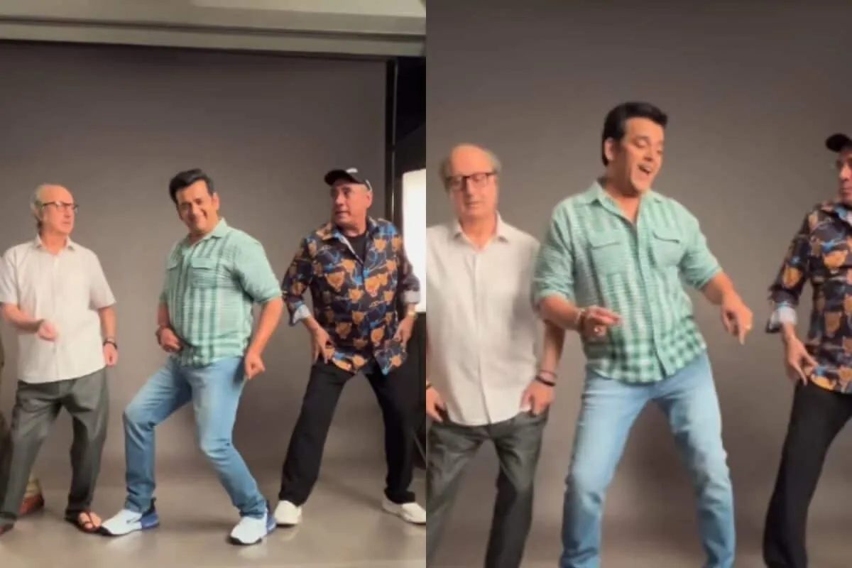Ravi Kishan, Anupam Kher, and Boman Irani smiling and posing together on a film set.