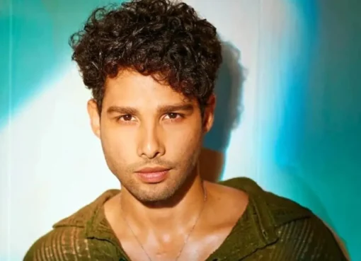 Siddhant Chaturvedi looking happy, possibly in a stylish setting.