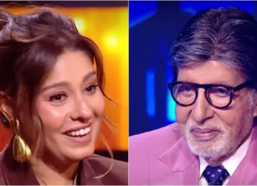 Sunidhi Chauhan smiling on the set of Kaun Banega Crorepati with Amitabh Bachchan.