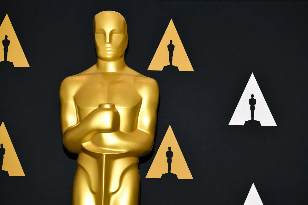 The Academy Awards logo with a spotlight.