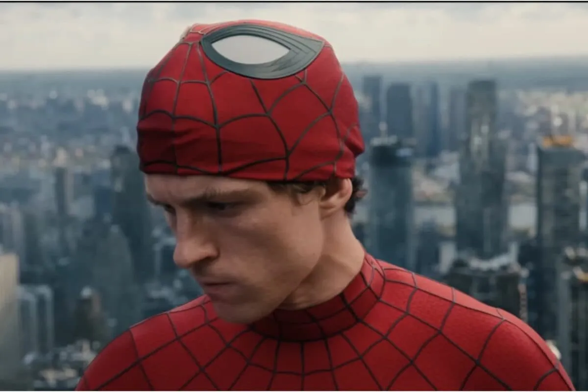 Tom Holland as Spider-Man swinging through a bright, futuristic city.