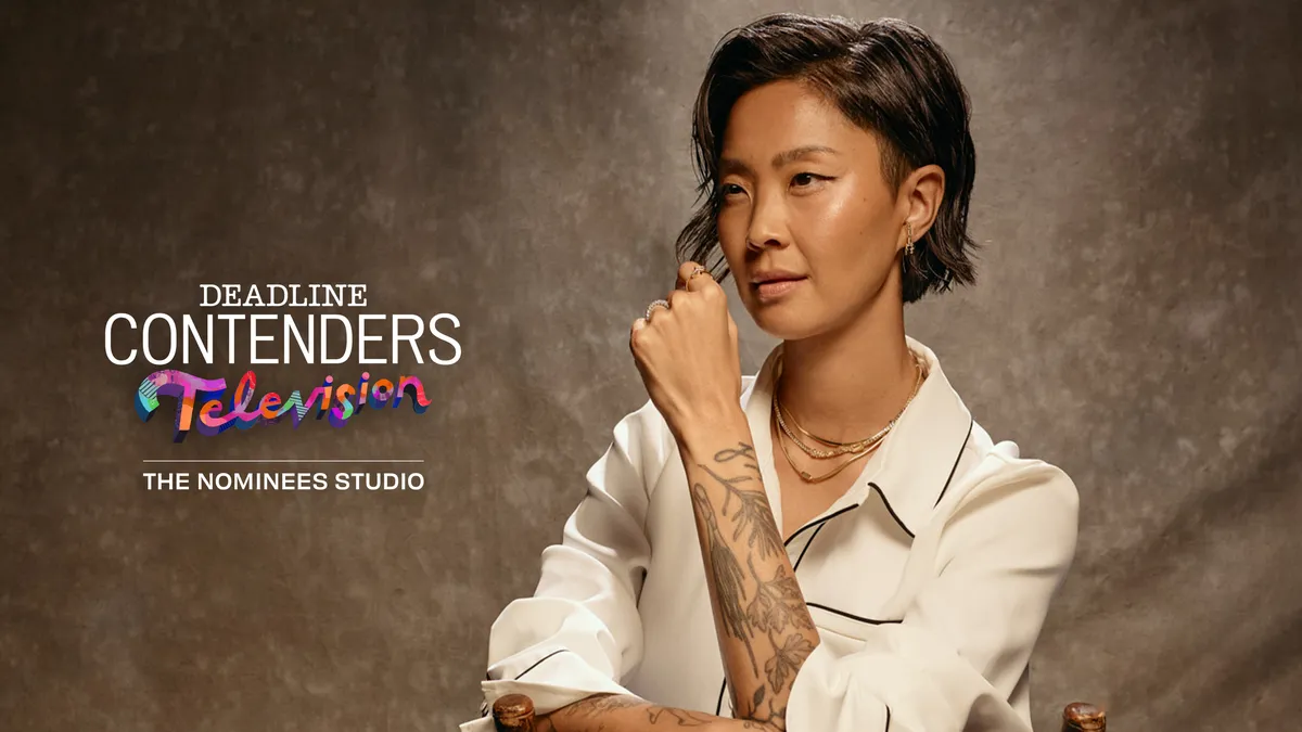 Kristen Kish smiles while hosting Top Chef.