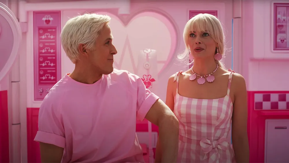 Margot Robbie as Barbie with a concerned or thoughtful expression, with a pink backdrop, symbolizing the sequel's uncertain future.