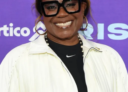 Sheryl Swoopes smiling during an interview about her experiences.