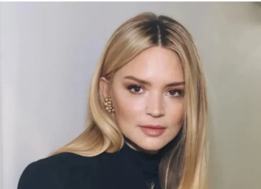 Virginie Efira smiling and looking elegant at a film festival event.