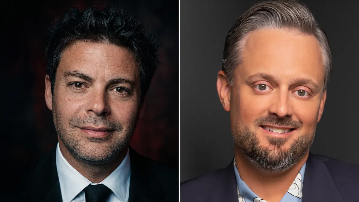 Nate Bargatze smiling, perhaps with a slightly mischievous look, against a blurred background.
