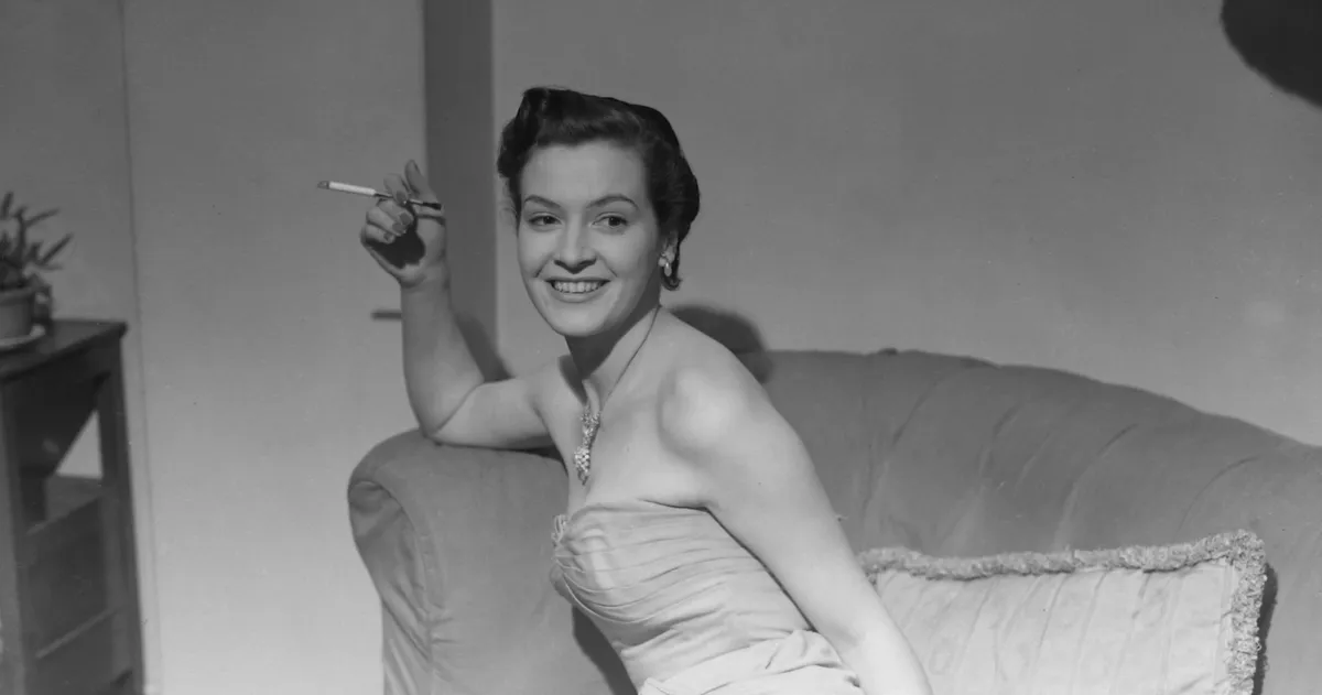 A smiling black and white headshot of Jean Lodge, a beautiful older woman with soft hair, from her younger acting days.