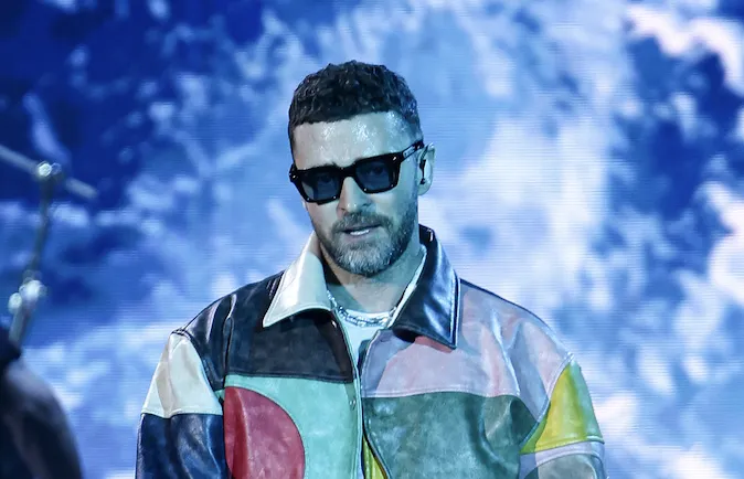 Justin Timberlake and Don Toliver performing together on stage under bright concert lights.