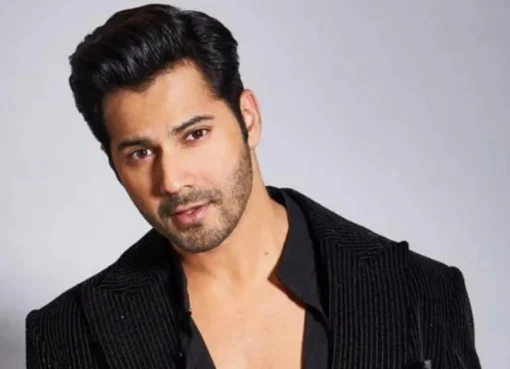 Varun Dhawan looking intense and serious, with a hint of a spooky background.