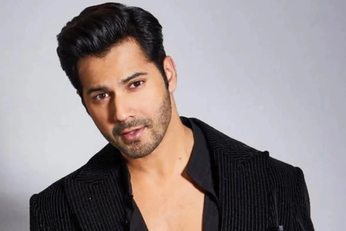 Varun Dhawan looking intense and serious, with a hint of a spooky background.