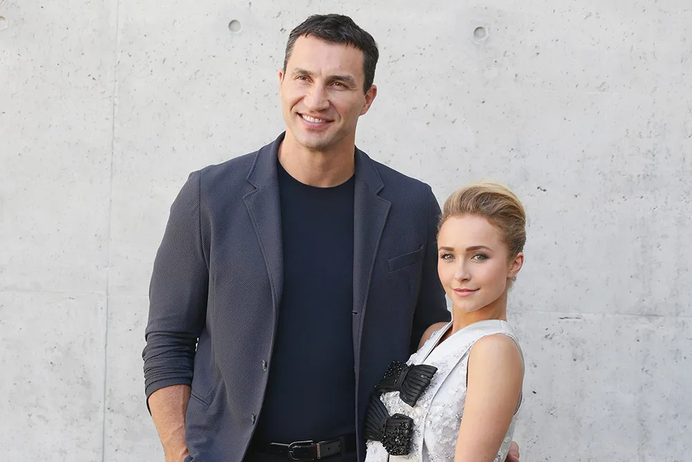 Wladimir Klitschko looking somber, possibly with a faint image of Hayden Panettiere in the background.