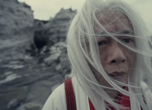 A still from 'The House on the Moon' showing a character in a mysterious, moonlit setting, hinting at graceful wuxia movements.