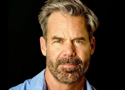 Tuc Watkins smiling.