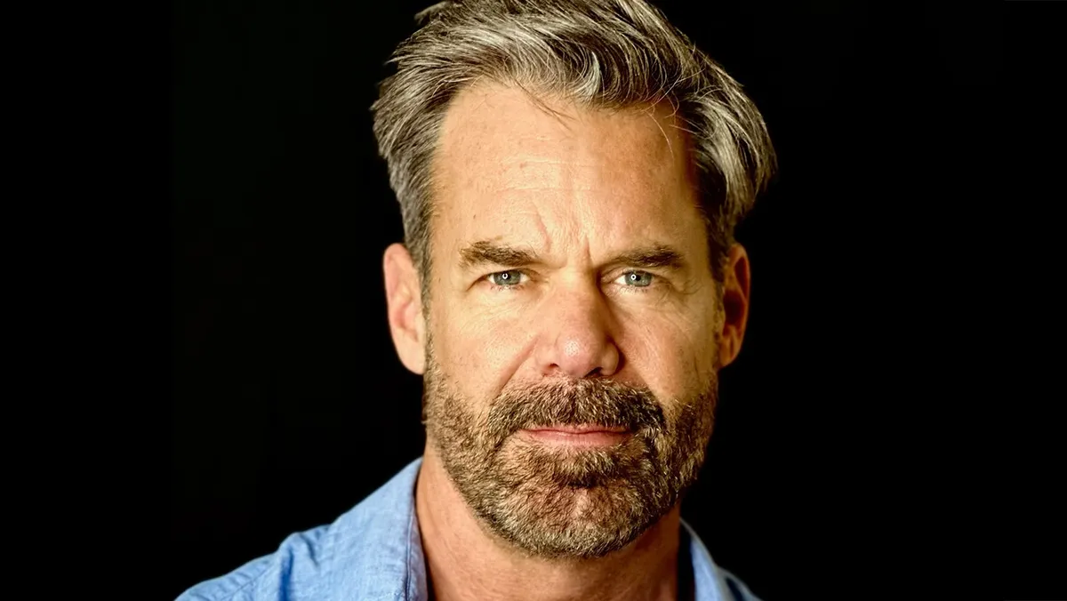 Tuc Watkins smiling.