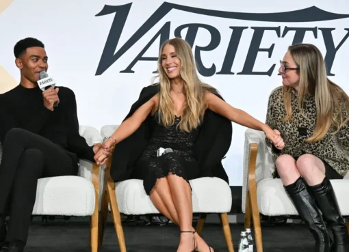 Executives and creators gather at a modern tech summit, possibly showing a panel discussion or networking.