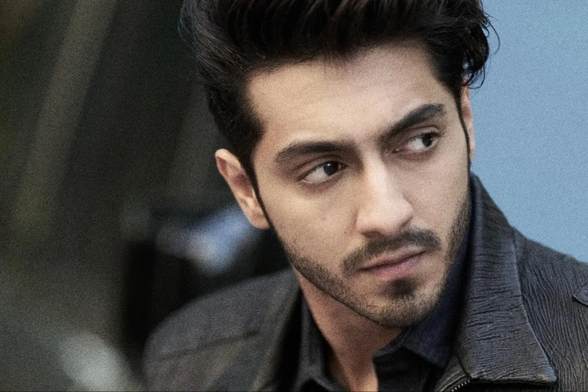 A candid photo of Ahaan Panday looking at his phone.