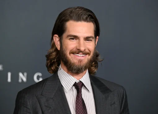 Andrew Garfield at a movie premiere, looking thoughtful.
