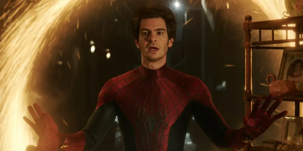 Andrew Garfield smiling and looking reflective during an interview.