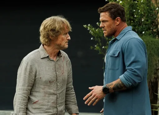 Owen Wilson and Alan Ritchson in a movie still from 'Runner', looking serious.