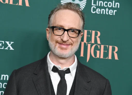Director James Gray smiling thoughtfully during an interview.