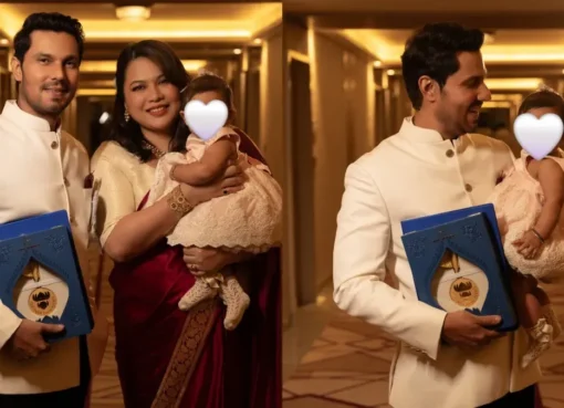 Randeep Hooda smiling with his daughter Nyomica at the National Film Awards.