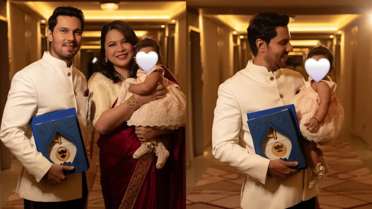 Randeep Hooda smiling with his daughter Nyomica at the National Film Awards.
