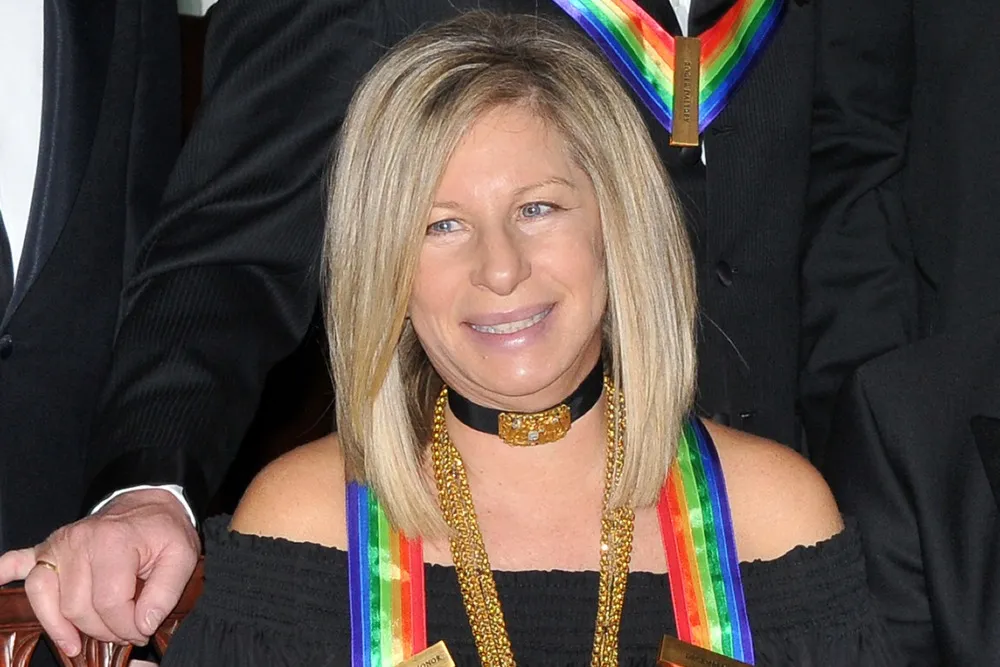 Barbra Streisand looking thoughtful and serious.