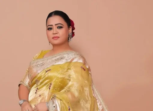 Comedian Bharti Singh smiling brightly while on stage.