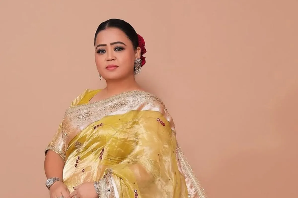 Comedian Bharti Singh smiling brightly while on stage.