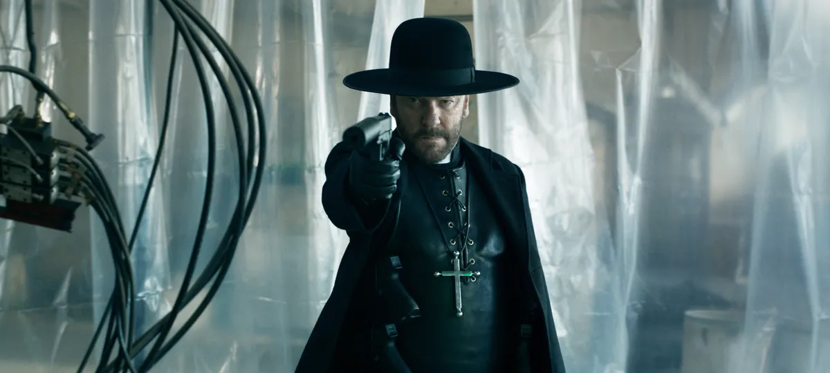 Kiefer Sutherland in character as Father Joe, looking determined with an intense expression.