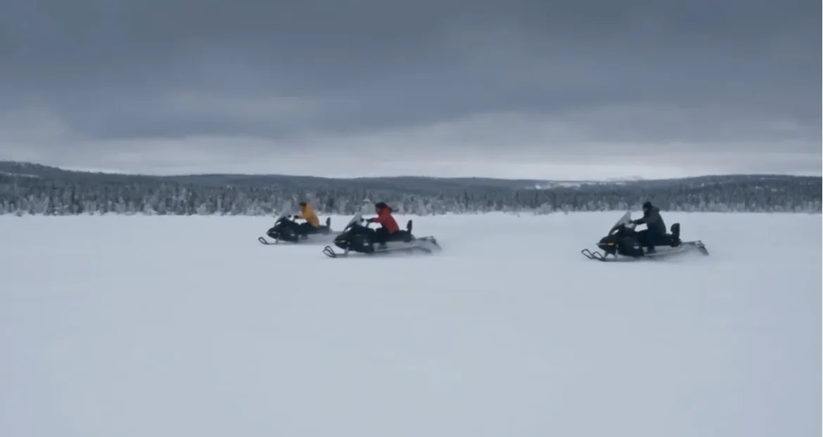 A snow-covered, desolate mountain range with a hint of danger, representing the film 'Snow Predator'.