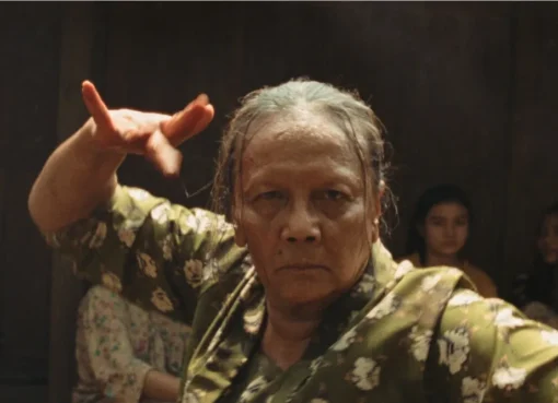 A promotional image for the film 'Ibuku,' possibly showing Christine Hakim in character.