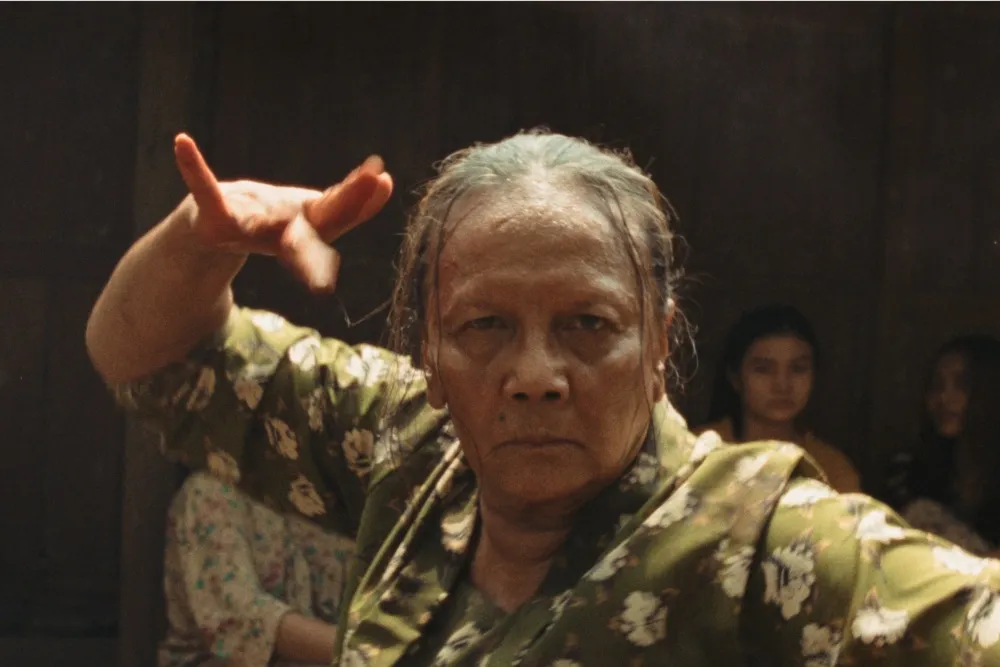 A promotional image for the film 'Ibuku,' possibly showing Christine Hakim in character.