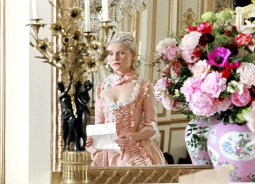 A still image from the documentary showing Eleanor Coppola observing a film set.