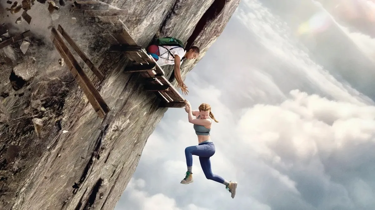 A tense movie scene with a person looking down from a great height.