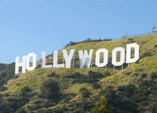 Film industry professionals discussing finances at a summit.