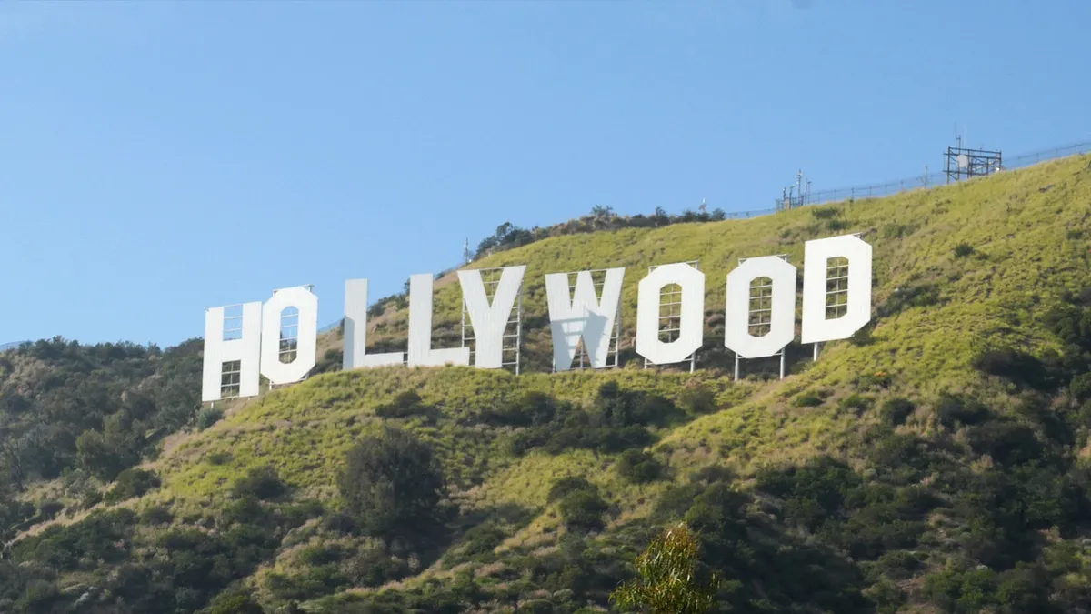 Film industry professionals discussing finances at a summit.
