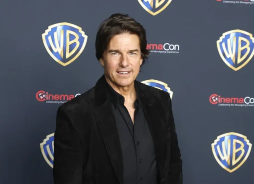 Tom Cruise smiling slightly during a video interview.