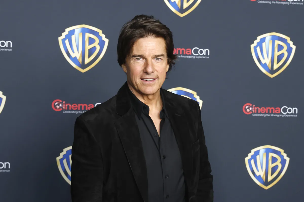 Tom Cruise smiling slightly during a video interview.