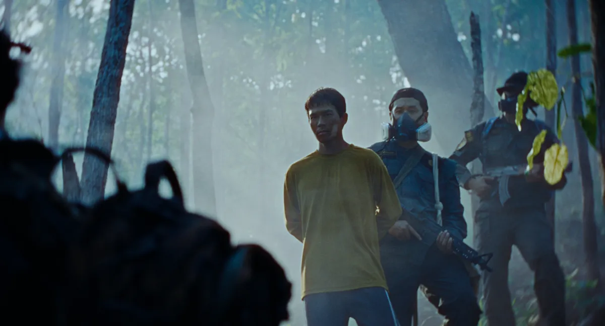 A foggy forest scene with purple skies, from the movie 'The Burning Giants'.