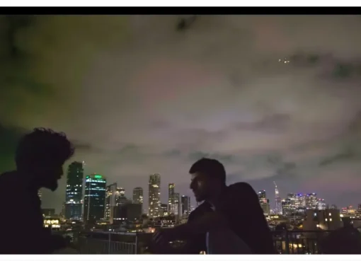 A still image from the documentary 'NAZA' showing a somber scene.