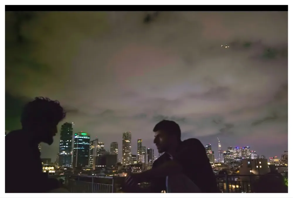 A still image from the documentary 'NAZA' showing a somber scene.